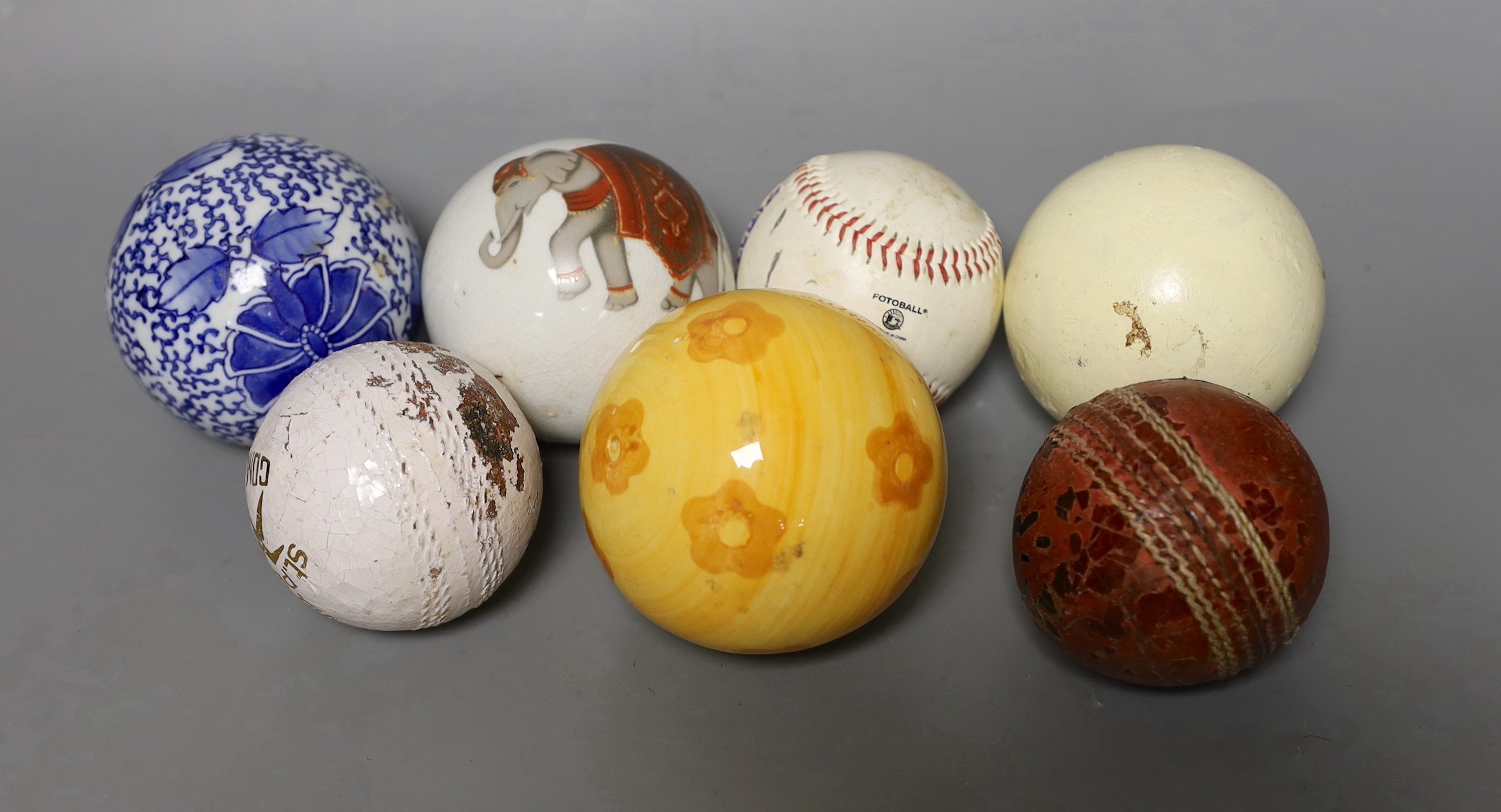 Three carpet bowls, three sports balls and a polo ball